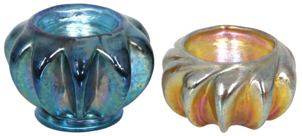Tiffany Studios Favrile Glass Salts: Tiffany Studios Favrile glass salts in blue and gold iridescence and have deep vertical ribbing. 1) Signed "L.C.T. X5392" and has paper label, 2 in. high x 2 3/4 in. diameter. 2) Signed "L.C.T. X53," 
