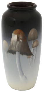 Rookwood Pottery Iris Mushroom Vase: Rookwood Pottery vase is decorated with a variety of mushrooms encircling the white to brown shaded background. Marked on the underside with flame mark dating it to 1904, shape number 904E, W for