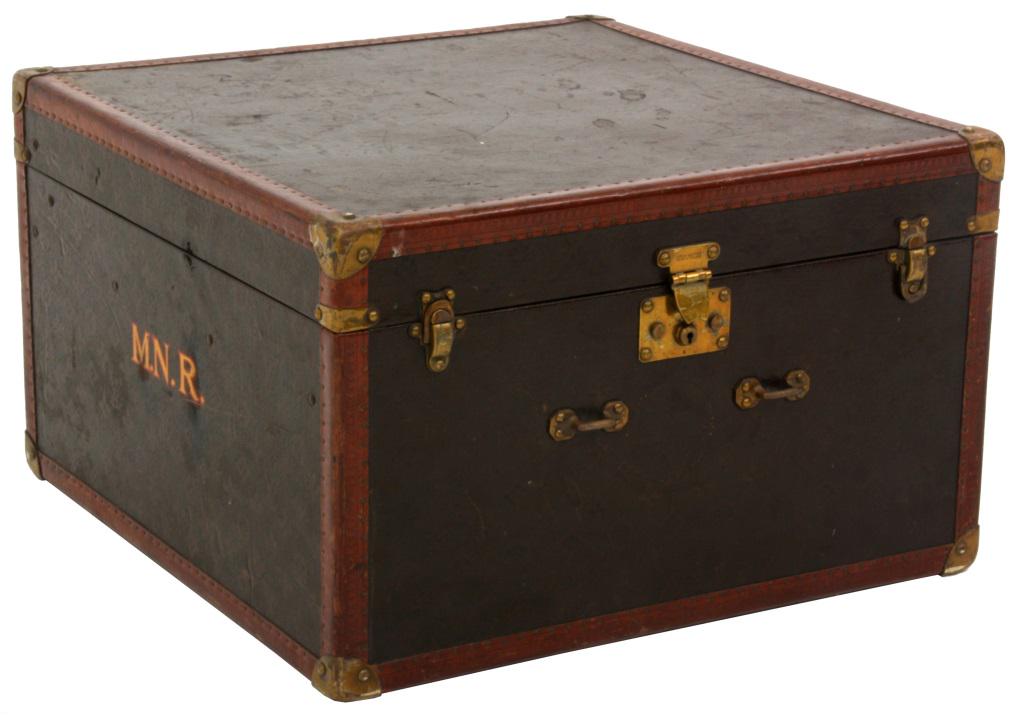 Louis Vuitton Monogram Hat Trunk: Nice size trunk has a monogrammed canvas exterior with tooled leather edges having brass tacks, brass corner escutcheons, latches and lock; canvas lined interior with pocket, strap woven crate inset w