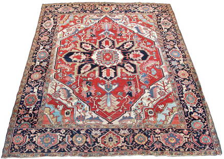 Hand Woven Heriz Rug (12.25 ft. x 10 ft.): Hand Woven Heriz Rug (12.25 ft. x 10 ft.) Has blue and red background in the center panel and border with stylized floral and filigree geometric shapes; missing its fringe, has some color fading. 148