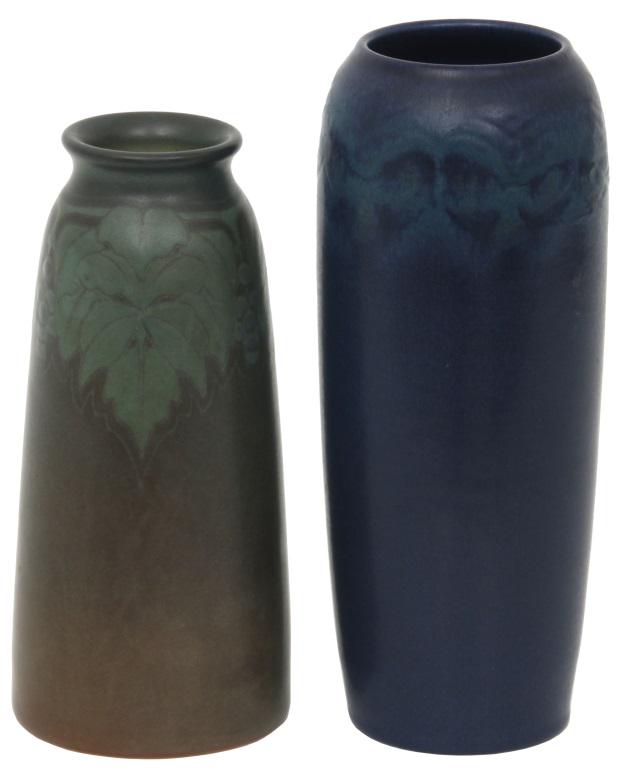 Two Rookwood Pottery Vases: 1) Rookwood green Vellum vase has clusters of berries and foliage; marked on the underside with flame mark dating it to 1911, shape number 1658E, V, GV, and artist signed "SX" for Sara Sax. 2) Rookwoo