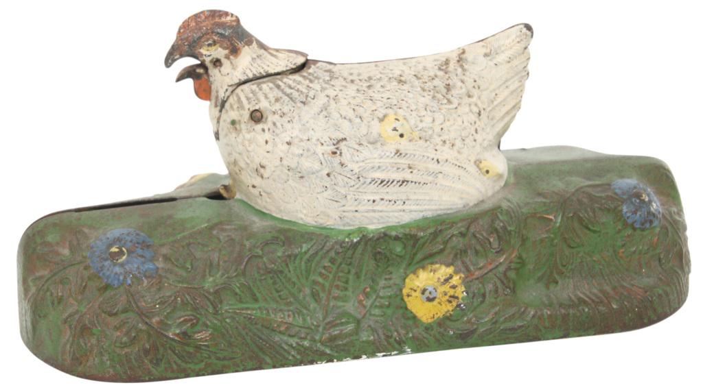 J. & E. Stevens Hen & Chick Mechanical Bank: J. & E. Stevens cast iron mechanical bank with a hen and chick surmounted on a floral decorated base. Place a coin in the slot in front of hen, raise the lever, and as the hen calls, the chicken sprin