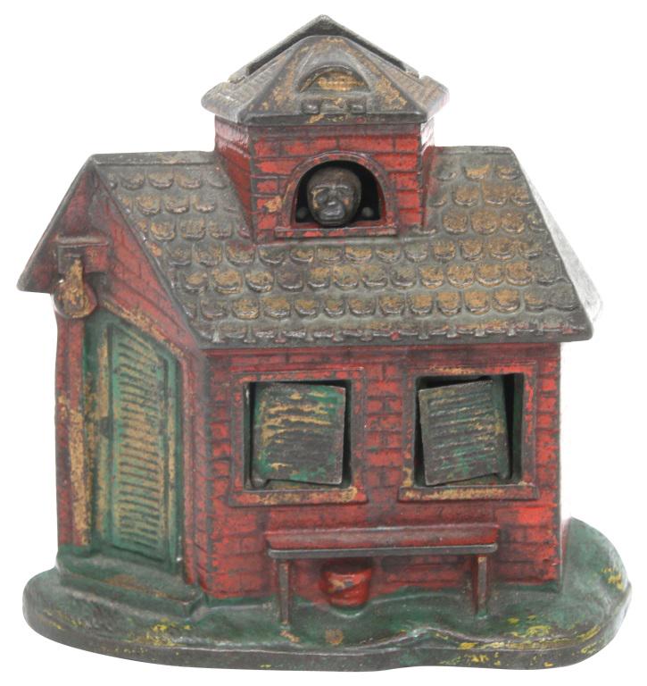 Kyser & Rex Cast Iron Mechanical Bank: Kyser & Rex "Press the Monkey" cast iron mechanical zoo bank. The functionality works by placing a coin in the slot and pressing the monkey's face; as the coin falls, the shutters open to reveal a lio