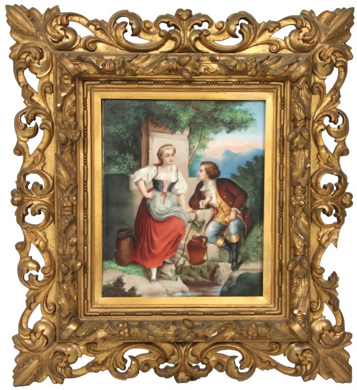 Hand Painted Porcelain Plaque: Hand Painted Porcelain Plaque. The plaque depicts a man and woman sitting by a fountain, filling up jugs with water; in the background are trees and large mountains. Dimensions: Frame: 23 in. high x 2