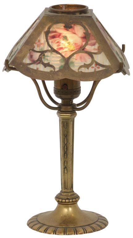 Pairpoint Floral Boudoir Lamp: Pairpoint boudoir lamp has four reverse painted ribbed panels with floral decoration, supported by a gilt metal base signed "Pairpoint" and numbered "E3064." 11 1/4 in. high x 6 1/4 in. wide x 6 1/4 i
