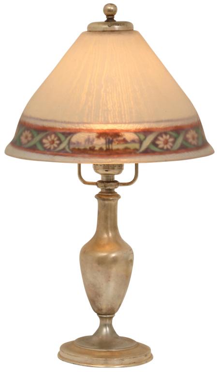 Pairpoint Carlisle Boudoir Lamp: Pairpoint boudoir lamp has a reverse painted Carlisle shade decorated with a band of alternating floral motifs and a landscape scene. The shade is supported by an urn form base, signed on the undersid