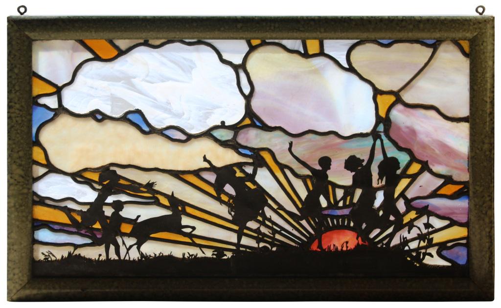 Handel Leaded & Stained Glass Window: The Handel Company Window with silhouette overlay figures dancing in front of a sunset sky leaded and stained glass signed "P.J. Handel, Meriden, Conn." early 20th century 12 in. high x 21 in. wide
