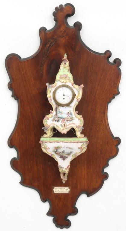 Veuve Perrin French Faience Bracket Clock: Veuve Perrin French faience bracket clock, powered by a small French verge fusee watch movement with the back plate measuring about 34mm, bottom of bracket with repaired damage, dial with damage at 6 
