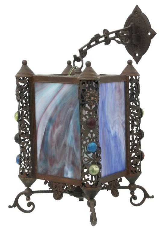 Brass & Jeweled Hanging Wall Sconce: Brass hanging wall sconce with reticulated corners having faceted jewels and four striated slag glass panels. 21 in. high x 9 1/2 in. wide x 15 in. deep.
