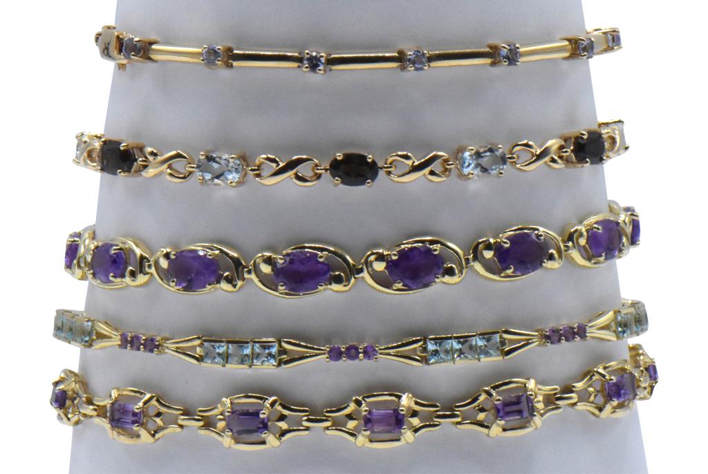 Five 10K Yellow Gold & Gemstone Bracelets: 1) 10K Yellow Gold & Tanzanite Link Bracelet Length: 7 1/8 in. 2) 10K Yellow Gold Aquamarine & Garnet Link Bracelet Length: 7 1/8 in. 3) 10K Yellow Gold & Oval Amethyst Link Bracelet Length: 7 3/8 in.