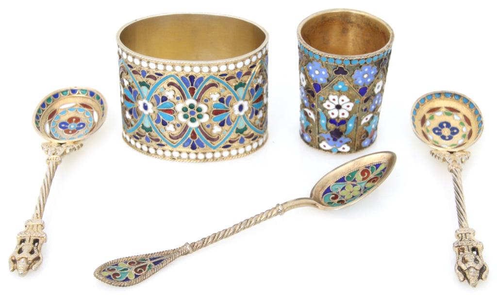 Five Russian Gilt Silver & Enamel Pieces: Lot of five Russian pieces include a napkin ring, small cup and three spoons that are decorated with gilt silver and enamel. Very good condition with the cup having a chip to one of the top enamel flo