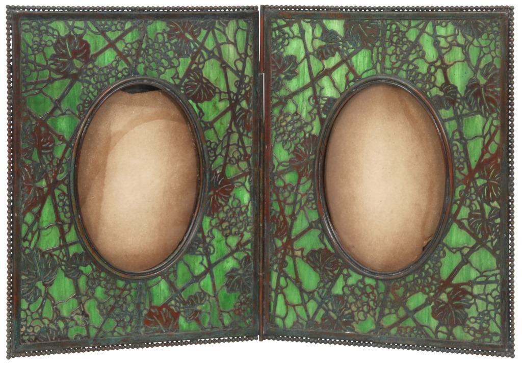 Tiffany Studios "Grapevine" Double Picture Frame: Tiffany Studios "Grapevine" Double Picture Frame early 20th century slag glass, patinated bronze signed "Tiffany Studios, New York" (both sides) 10 in. high x 16 in. wide