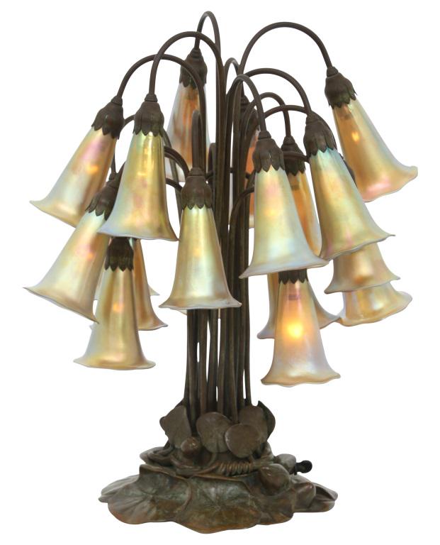 Tiffany Studios 18 Light Lily Lamp: Tiffany Studios 18 Light Lily Lamp early 20th century patinated bronze with reproduction iridescent shades signed "Tiffany Studios, New York, 21817" with monogram 20 in. high