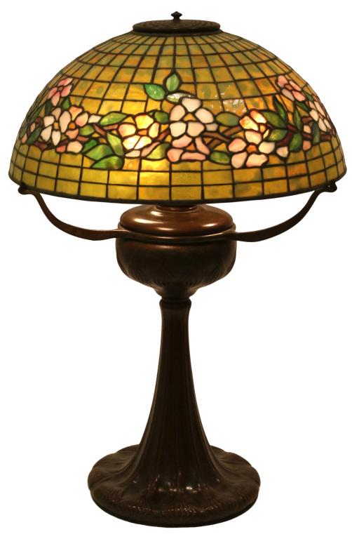 Tiffany Studios "Banded Dogwood" Table Lamp: Tiffany Studios "Banded Dogwood" Table Lamp circa 1910 leaded glass, patinated bronze shade signed "Tiffany Studios, New York, 1556" base & oil canister signed "Tiffany Studios, New York, 8354" 27 in.