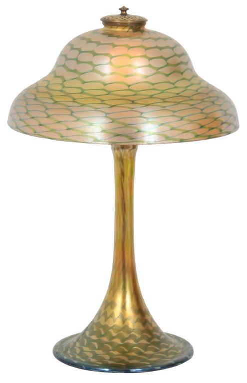 Tiffany Studios Favrile Glass Table Lamp: Tiffany Studios Table Lamp early 20th century Favrile glass, gilt bronze shade signed "L.C.T. Favrile" (top rim) base signed "L.C. Tiffany – Favrile" (underside) 18 in. high, 12 in. diameter
