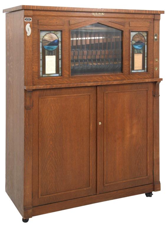 Link 2E Coin Piano with Mandolin and Marimba: Link Piano Company, Inc. (Binghamton, New York) 2E Coin Piano with Mandolin and Marimba circa 1920 quarter sawn oak, leaded glass with 15 rolls stenciled "Link, Binghamton, N.Y." signed with metal com