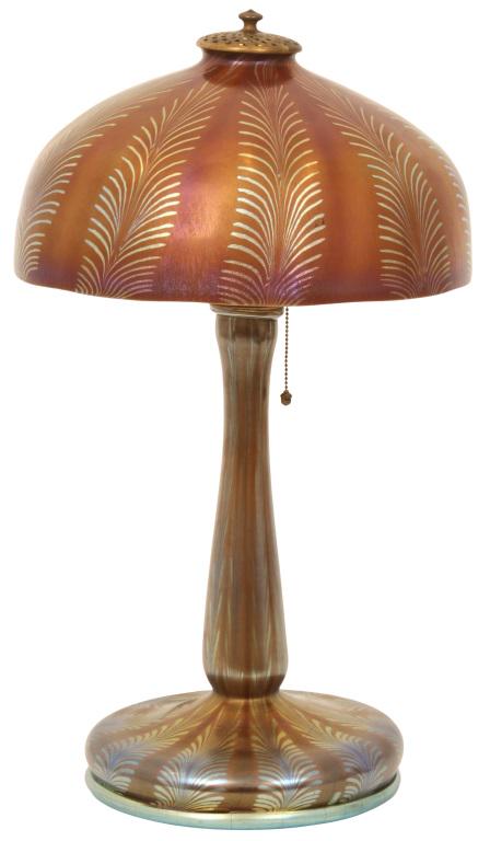 Tiffany Studios Decorated Table Lamp: Tiffany Studios Decorated Table Lamp circa 1915 Favrile glass, gilt bronze with vertical feather decoration shade signed "L.C.T." base signed "L.C. Tiffany-Favrile" 17 1/2 in. high, 10 in. diameter