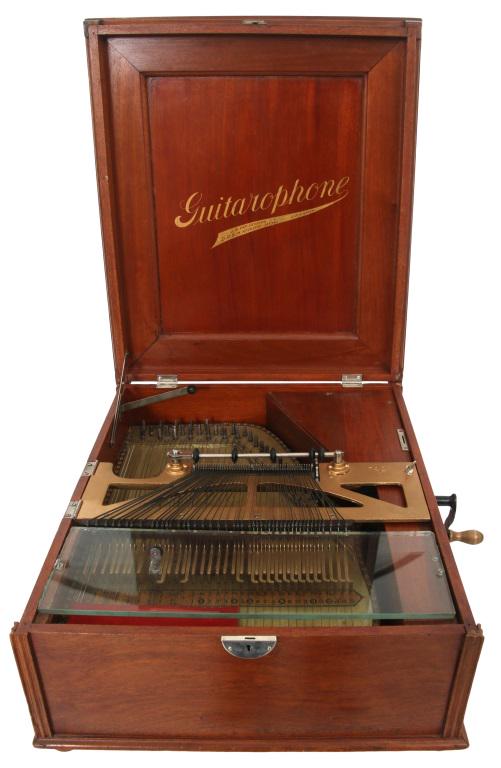 Menzenhauer's American Guitar Zither: Friederich Menzenhauer (1858-1937) American Guitar Zither "Guitarophone" late 19th century mahogany signed with stencil 9 x 18 x 21 inches