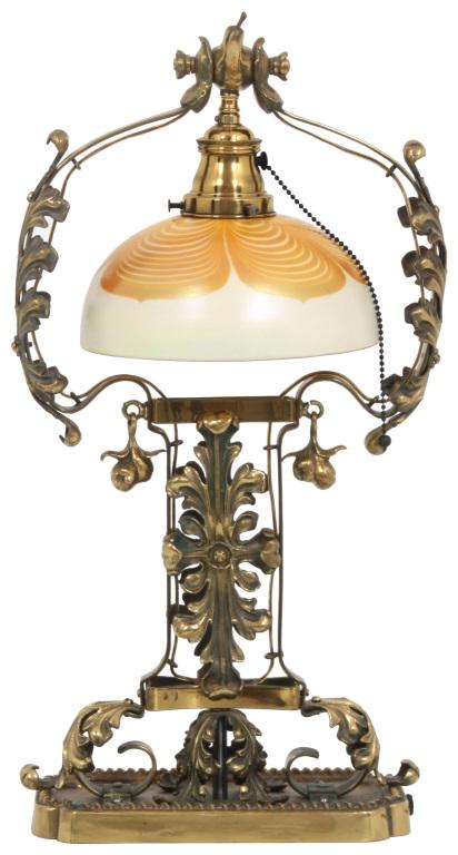 Steuben Pulled Feather Desk Lamp: Steuben Glass Works (Corning, New York, est. 1903) Pulled Feather Desk Lamp early 20th century iridescent glass, gilt bronze shade signed with partial fleur-de-lis signature 21 3/4 in. high, 8 in. dia