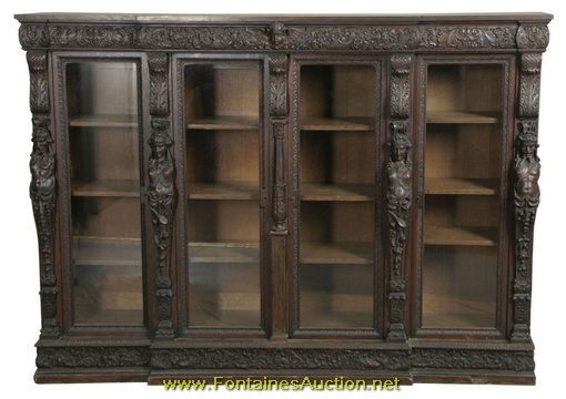 Large Oak Figural 4 Door Bookcase attr. R.J. Horner: Large Oak Figural 4 Door Bookcase attr. R.J. Horner. Figural carved mountain men on the outside and maidens inside, each is carved from the waist up over scrolled pilasters; Has a block-front design w