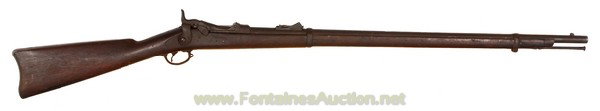 Springfield Model 1879 Trapdoor Rifle: 32 5/8" barrel is chambered in 45-70 and has a good bore. The breech block is marked US model 1873 in 3 lines and the SN# IS 277427 making this a very late model 1879. Metal surfaces are mostly brown 