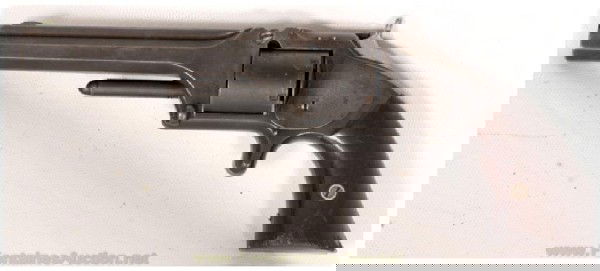 Smith & Wesson NO. 2 Old Model Revolver: 5" Barrel is chambered for .32 rimfire and has a good bore with very minor scattered pitting. This ia a Civil War Era pistol with a SN 22282. Metal surfaces are mostly a faded blue and the rosewood gr