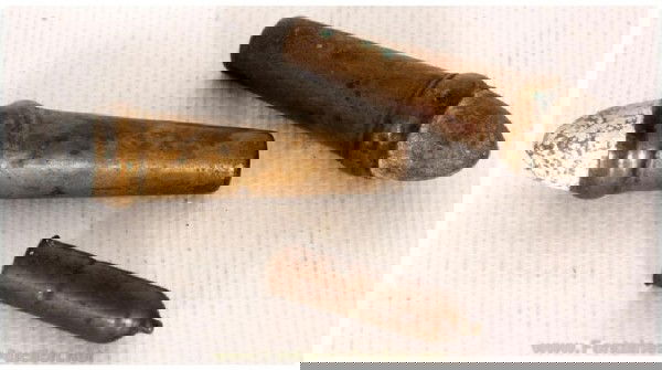 Lot Of Early Cartridges: Two 54 caliber Burnside cartridges in very good condition and one 32 caliber teat fire also in good condition.