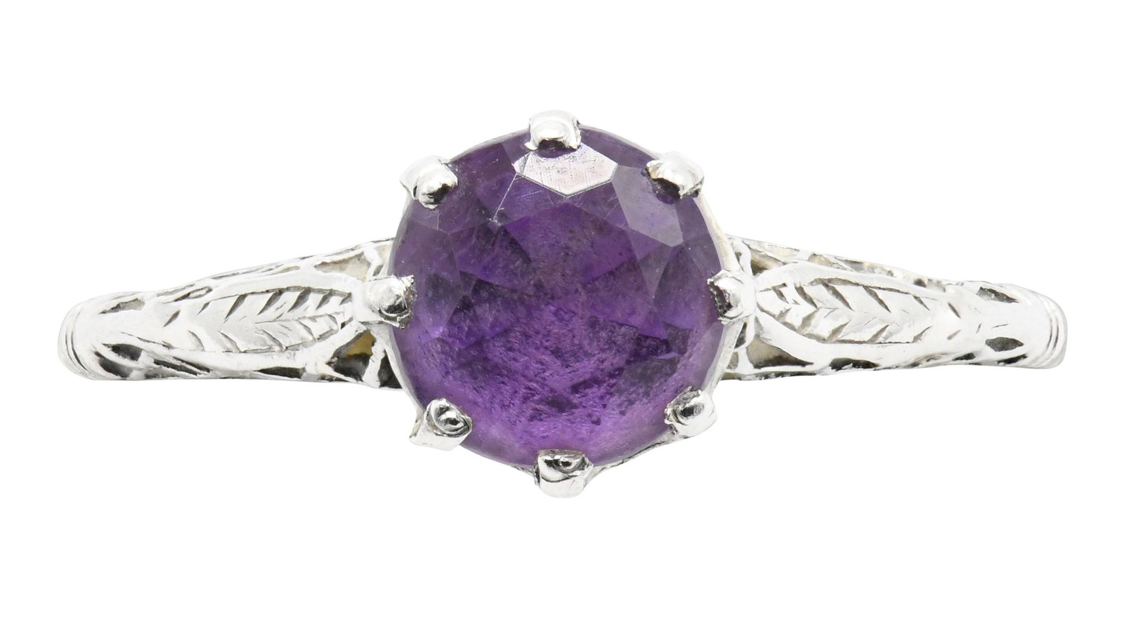 Platinum and Purple Iolite Ring: Centering a round shaped purple iolite weighing a total of 0.90 caratsPlatinum5 1/4 (size)0.08 ounces (total weight)Due to the limitations imposed by a mounting all gemstone weights are approximate.