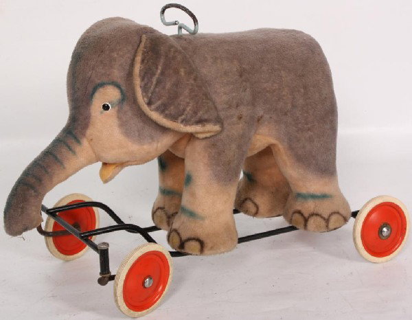 Steiff Stuffed Childs Elephant on Wheels.: Steiff Stuffed Childs Elephant on Wheels. Signed on the wheels and a tag on the ear.