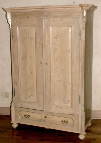 2 Door Pine Armoire: 2 Door Pine Armoire. Has Nice corbels on the corners, bun feet and a single drawer at the base; with a clean natural finish. 73" x 53"W x 26"D
