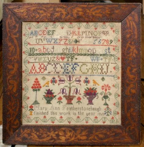 Sampler by Mary Ann Featherstonehaugh 1863: Sampler by Mary Ann Featherstonehaugh 1863. In a fine folk art frame and in excellent condition. 13" x 12"
