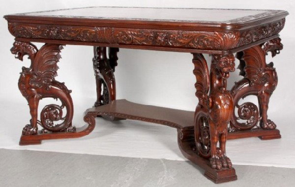 Attr. R.J. Horner Griffin Mahogany Partners Desk Fu: Full standing winged griffins support the top and sit on a platform with a raised center. The front and back drawers are carved with animal heads for pulls. The top border and skirt are carved with fl