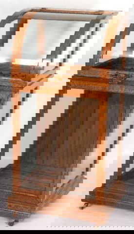 Oak Country Store Cane Case Original curved glass: Original curved glass door lifts to access the storage and display area for canes in a country store. The canes are devided by a stick & ball compartment. The case is refinished and the door pull is a