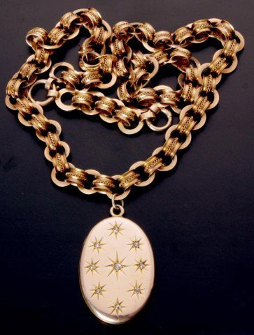 10K Gold Chain W / Locket: 10K Gold Chain W / Locket. Heavy gold chain w/ cylinder links and rope twist embellishments, 21 long. 40mm gold locket studded with 9 small diamonds; monogrammed "MN" on the back. 1.48 oz"