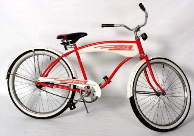Coca Cola - Huffy Promotion Bike: Coca Cola - Huffy Promotion Bike. Circa 1980's; Original red and white paint, plastic body with decals no cracks, original seat, nice white walled tires. 38 1/2" x 70" Long.
