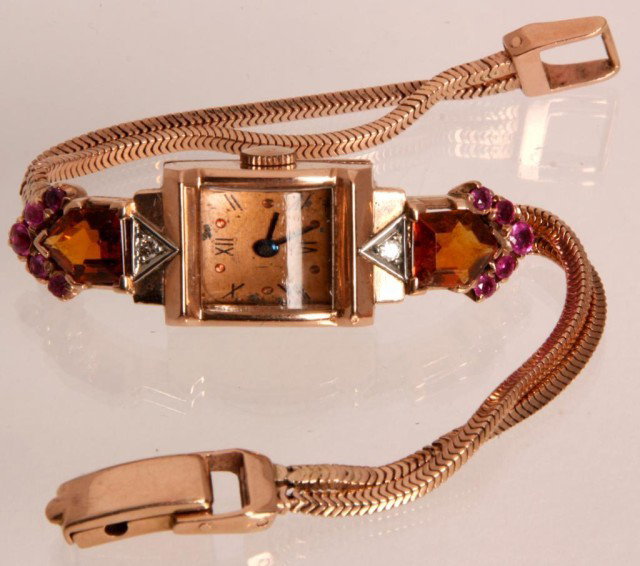14K Pery Ladies Watch W/ Citrine & Rubies: 14K Pery Ladies Watch W/ Citrine & Rubies. Fine 14K rose gold case and band with 2 large irregular cut citrines 10 round rubies and 2 diamonds. 17 Jewel Swiss movement, signed and numbered Pery - 1616