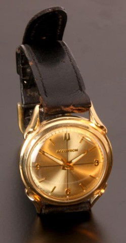 14K Gold Bulova Accutron 214 Wristwatch: Bulova Model 214 rear wind and set 14K solid gold Accutron. The watch has good original hour, minute and sweep hands and original dial with plastic crystal. The watch winds but is not running since it