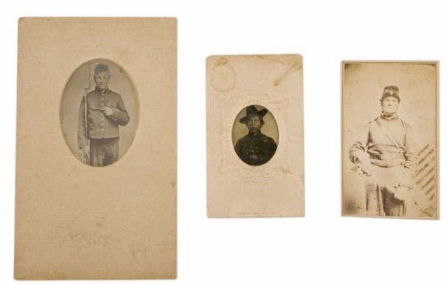 3 CIVIL WAR PHOTOGRAPHS OF SOLDIERS: First is a Union soldier with a muzzle loader and pistol, cut to an oval and mounted to cardstock 4"H x 2.5"W. Second is a Carte de Visite of a Union cavalry soldier armed witha sword and a flag back