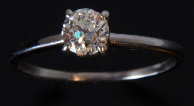 14k White Gold & Diamond Solitaire Ring: 14k White Gold & Diamond Solitaire Ring. White gold band, size 9; with one large prong set round brilliant cut diamond, approximately 6mm across. 0.1 oz