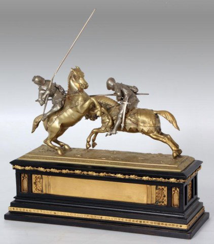 Oskar Gladenbeck (1850-1921, Germany): Oskar Gladenbeck (1850-1921, Germany) Figural Bronze & Wood Grouping - Jousting. Bronze figural 2 tone grouping with 2 nights on their horses, jousting; on an ebonized wood base with gilt mounts. Titl