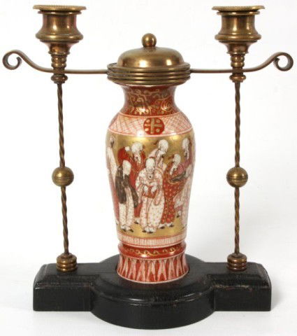 Fine Kutani Candleabra: Fine Kutani Candelabra. Fine Japanesque hand decorated vase mounted with a pair of twisted brass candle arms on an ebony wood base. 9in High.