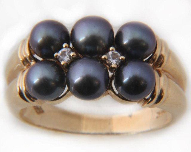 14K Mikimoto Black Pearl & Diamond Ring: 14K Mikimoto White Pearl & Diamond Ring. Fine yellow gold pearl cluster ring containing 6 pearls measuring approximately 5mm and 2 small prong set diamonds. Has 14K gold mark and Mikimoto hallmark. Si