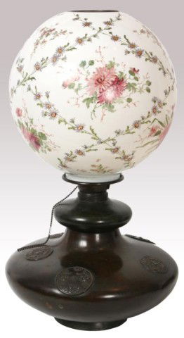 Large Gone With The Wind Lamp: Large Gone With The Wind Lamp. 12.5 in. globe obverse painted with red chrysanthemums, lilies and roses with crossed bands of purple flowers. On a unique bulbous bronze base with molded medallions. 23