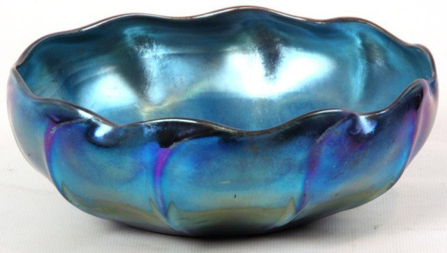 Tiffany Favrile Blue Iridescent Nut Bowl: Tiffany Favrile Blue Iridescent Nut Bowl. Beautiful bowl with vertical ribs running around the body and a wavy rim; had a deep electric blue silvered iridescent finish with nice purple highlights. Has