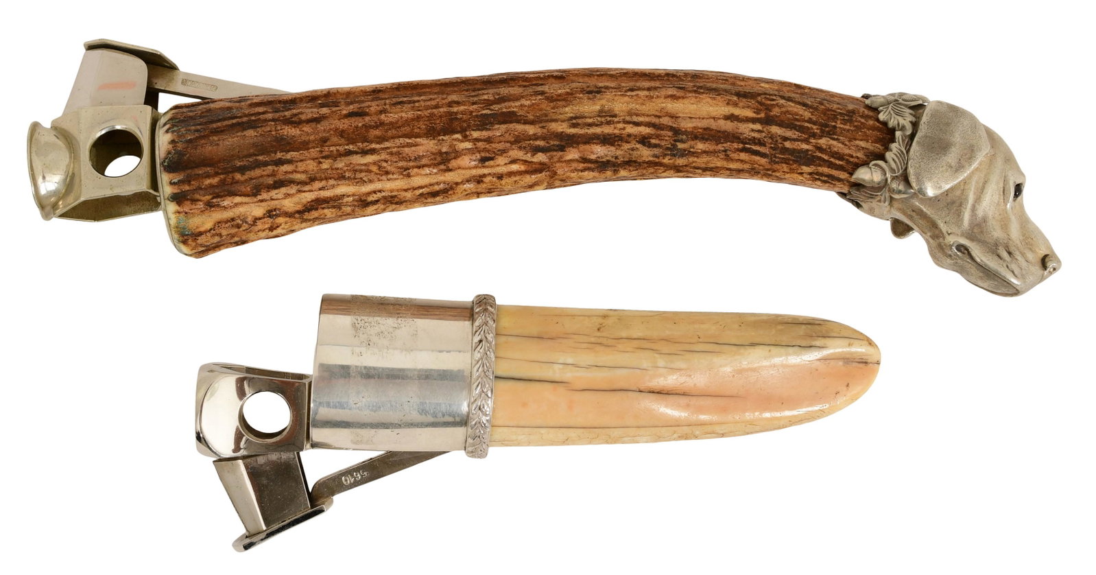 Two Sterling Silver Cigar Cutters: Two Sterling Silver Cigar Cutters 20th century comprising: 1) M.W. & Co. Ltd., antler and sterling silver, with a dog's head with ruby eyes, marked "M.W. & Co. Ltd., Foreign, 925," 8 x 2 inc