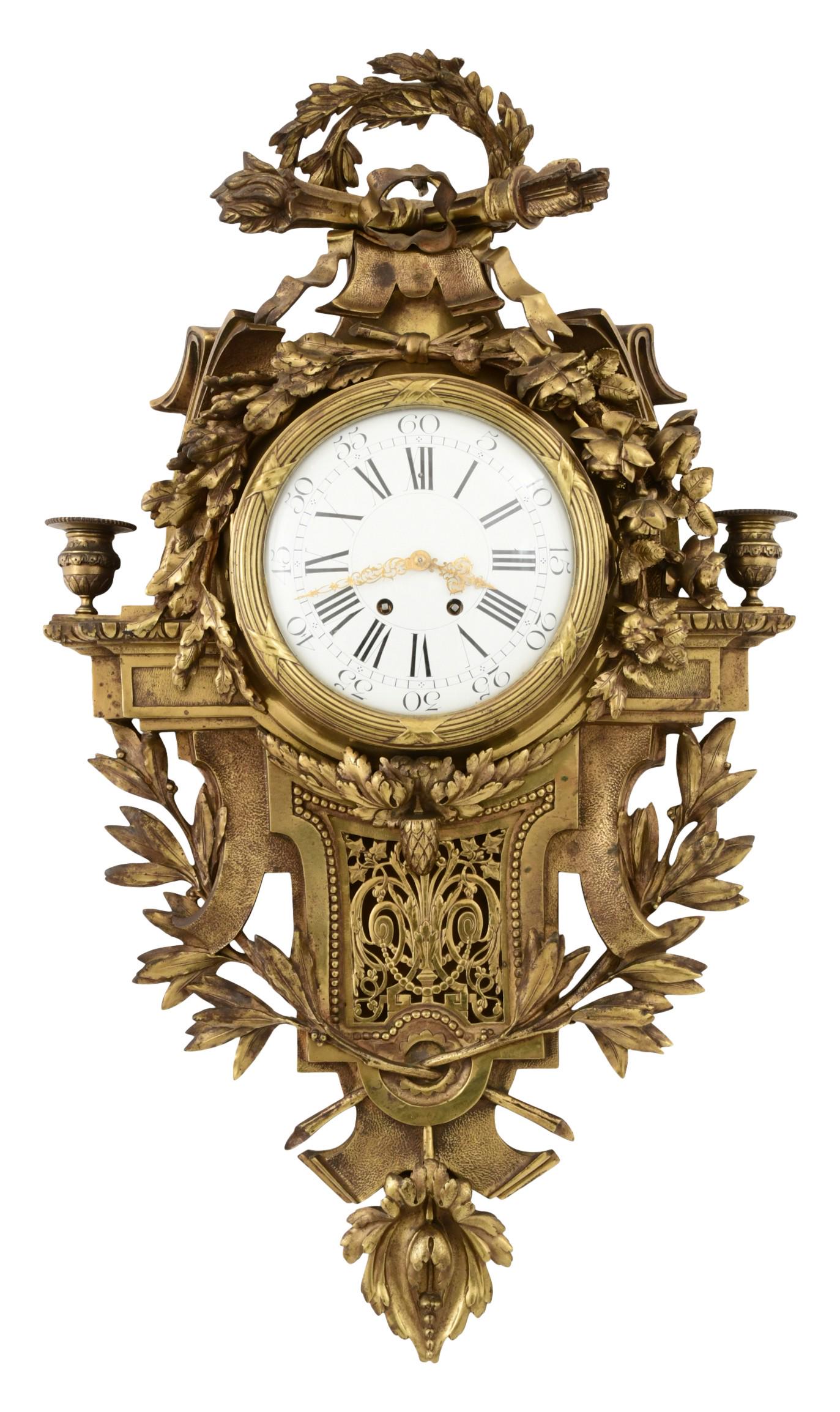 French Louis XVI-Style Gilt Bronze Cartel Clock: French Louis XVI-Style Gilt Bronze Cartel Clocklate 19th centurydecorated with a wreath, ribbon, arrow quiver and torch on the crest with hanging roses and filigree, side candle arms at the shoulder,