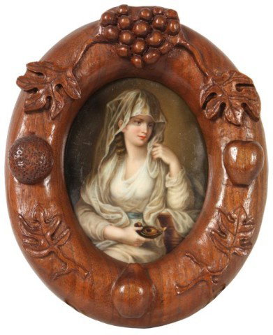 Porcelain Plaque - Vestal Virgin After Kauffmann: Porcelain Plaque - Vestal Virgin After Kauffmann. Oval portrait of a seated woman facing right, she wears a veil and holds a small oil lamp. in a carved black forest frame. 4.25 in. x 3.25
