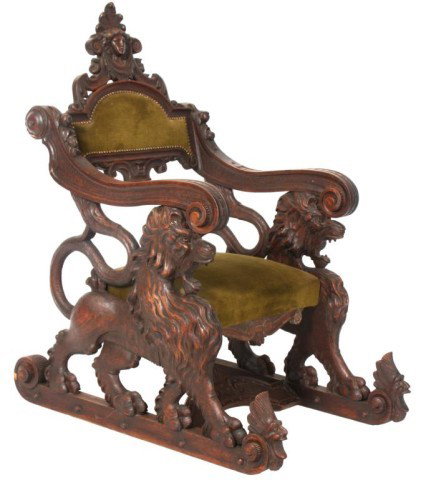 Carved Walnut Fantasy Lion Chair: Carved Walnut Fantasy Lion Chair. Heavily carved chair has a sleigh style foot with full standing figural lions forming the sides, wavy arms scroll at the knuckle; the back has a pierce carved crest c