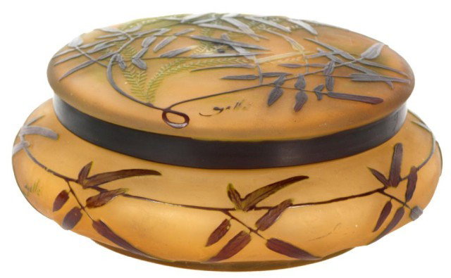 Galle Covered Dresser Box: Galle Covered Dresser Box. Depicting thin brown and green leafy branches on a frosted orange back; Galle cameo signature, in very good condition with no breaks, chips or cracks. 3 in. High x 7 Dia