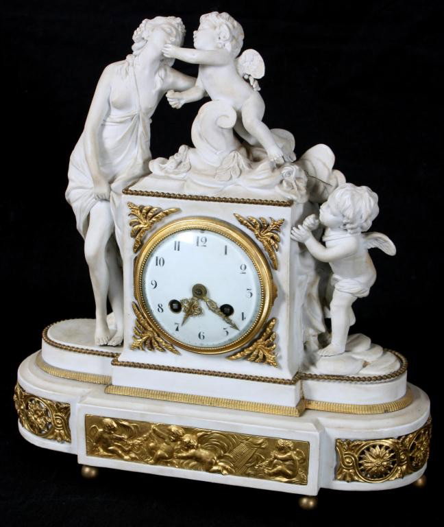 Sevres Venus & Amor Porcelain Clock: Sevres Venus & Amor Porcelain Clock. Round enamel dial with black arabic hour numerals and fancy gold hands, typical Samue Marti round brass movement, strikes on a single bell. Case shows Venus to the